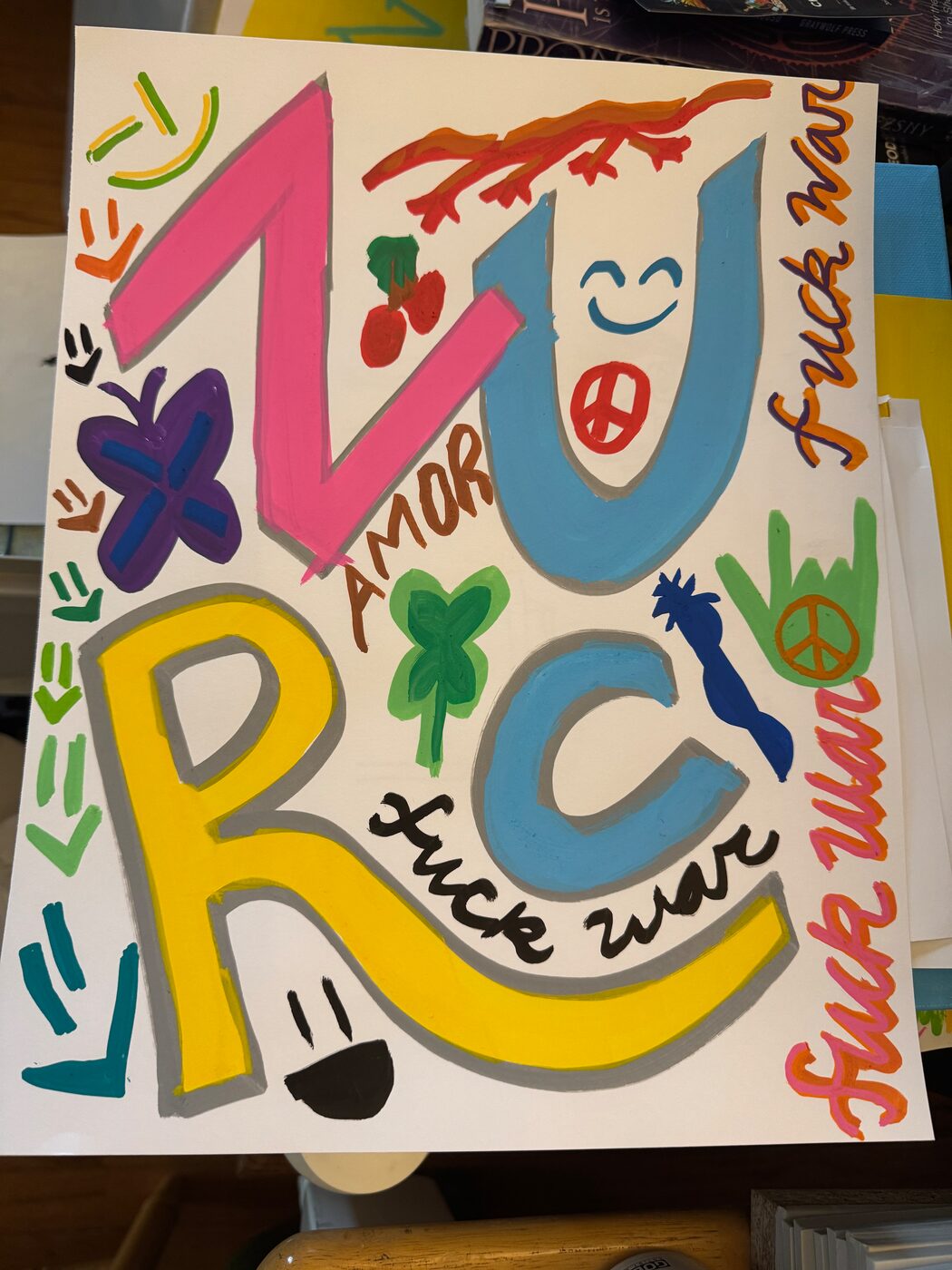 ZURC in big pink, blue and yellow letters with gray shadows, the U smiling with a peace sign for a mouth and the R with a face, AMOR between the Z and the U, fuck war written three times in script, with cherries, a clover, a branch and hand signs around them